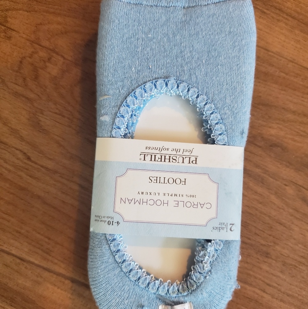 2 pair of light and lighter blue no skid footies.